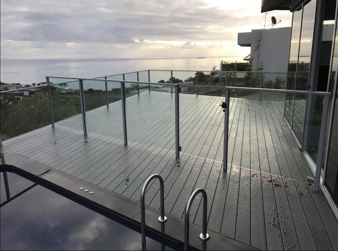 Composite deck with glass balustrade and ocean view